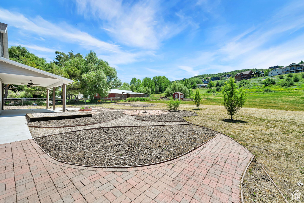 View of yard with ceiling fan