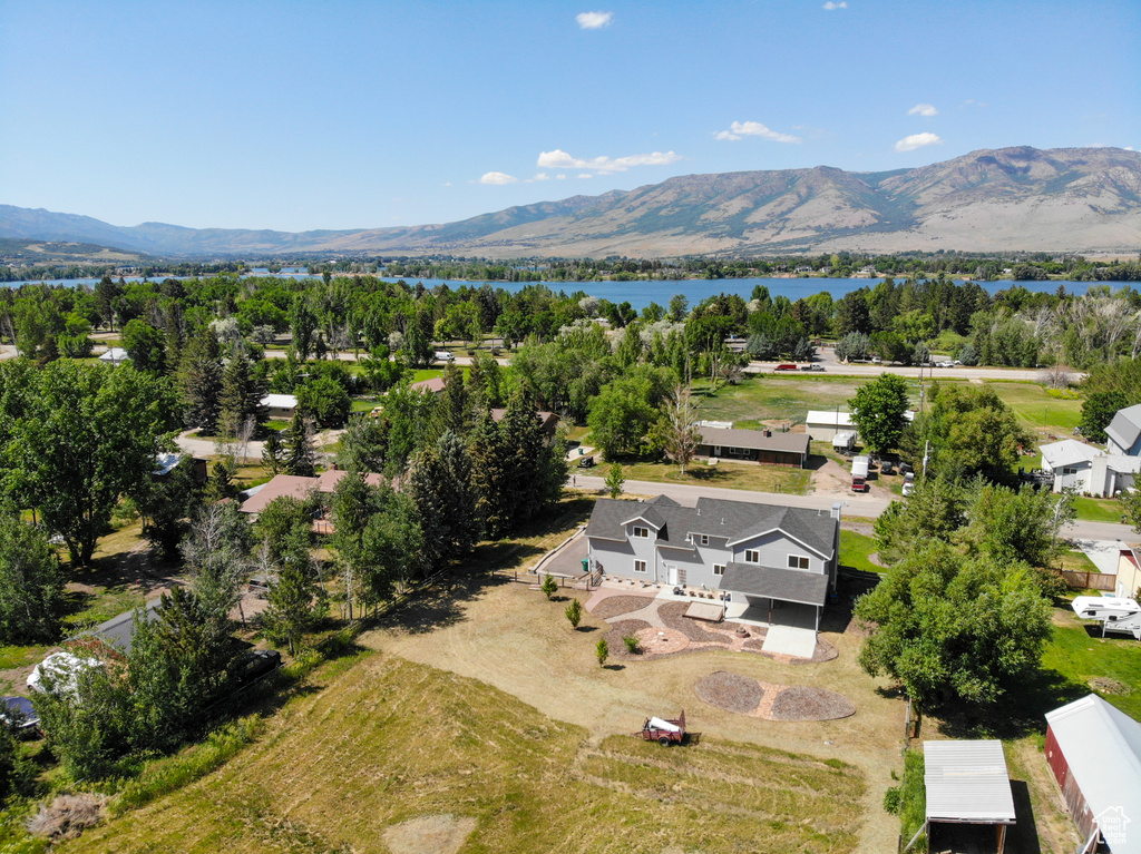 Aerial perspective of suburban area with a water and mountain view
