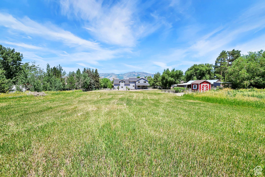 View of yard featuring an outdoor structure and a mountain view