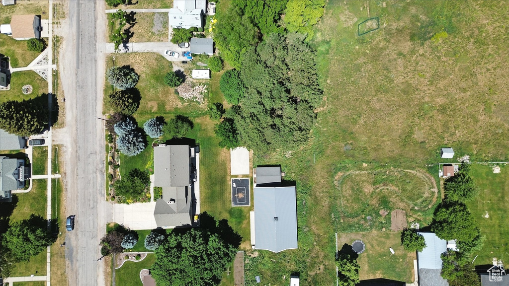 Aerial view of property's location with nearby suburban area