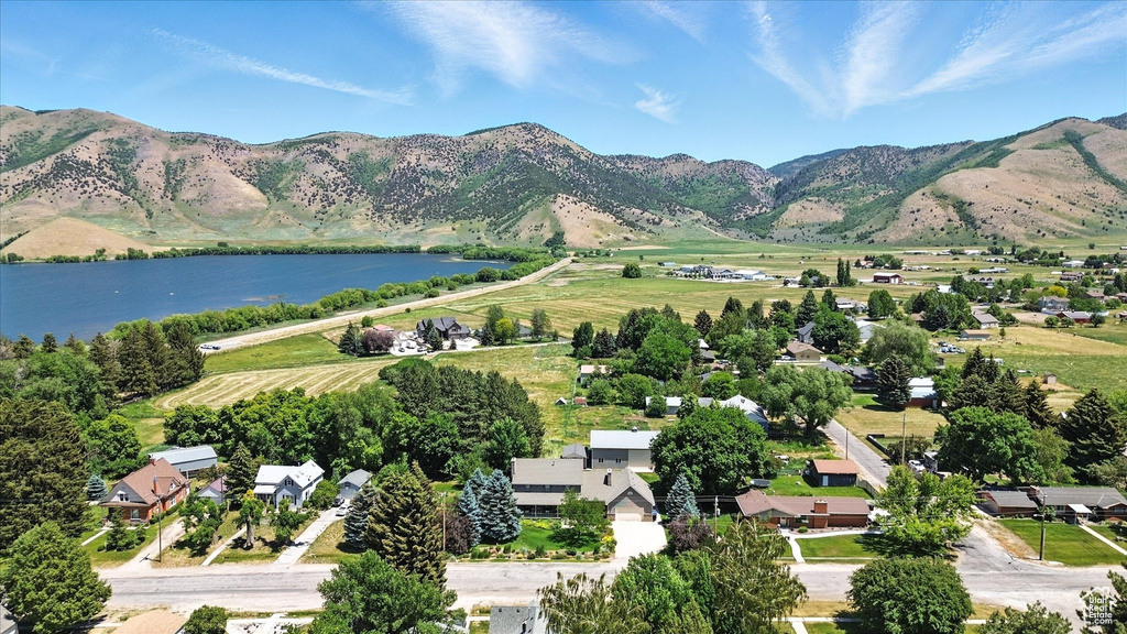 Aerial overview of property's location featuring a water and mountain view