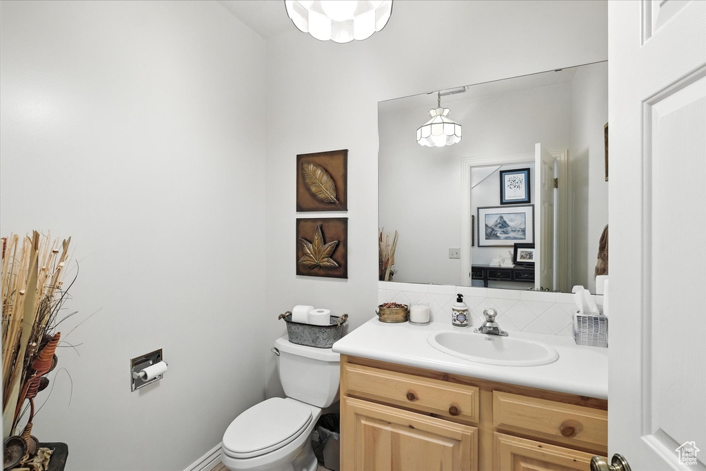 Half bath with vanity and toilet