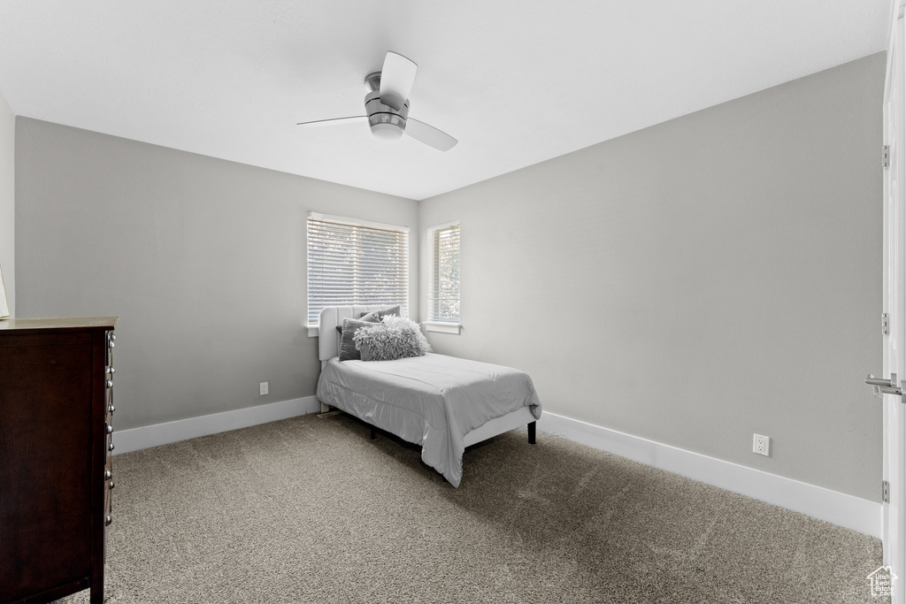 Bedroom featuring carpet and a ceiling fan