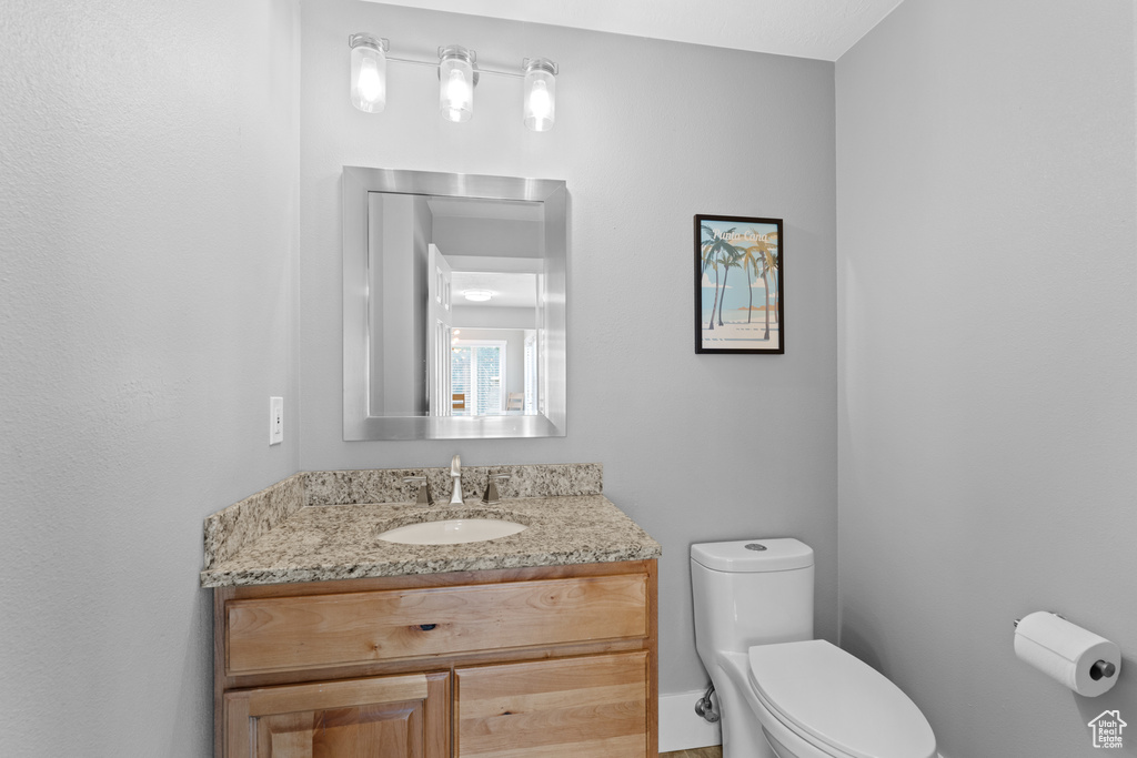 Bathroom featuring toilet and vanity
