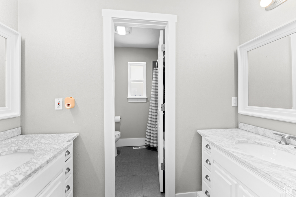 Full bathroom featuring vanity and tile patterned floors