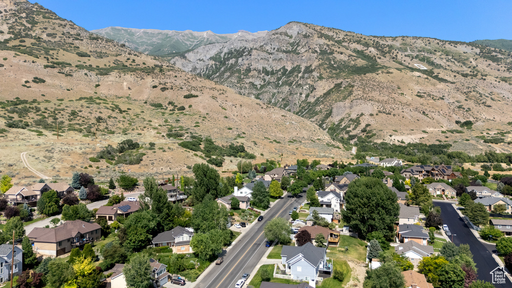 View of property location with a mountainous background and nearby suburban area
