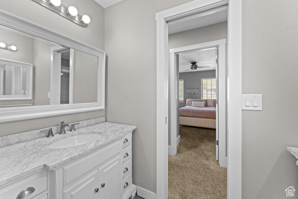 Bathroom with vanity and a ceiling fan