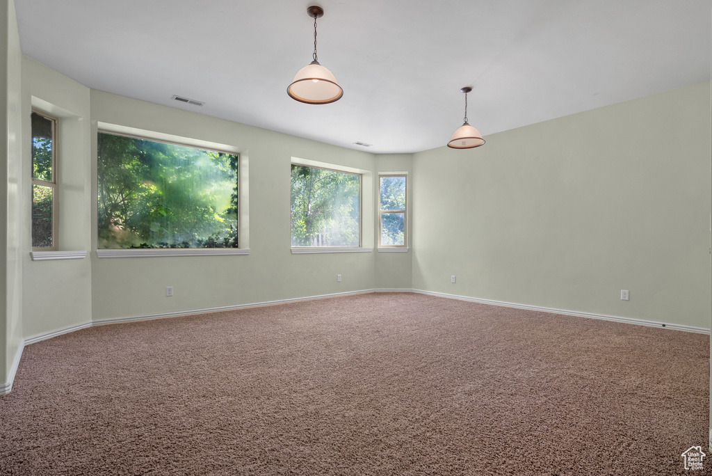Empty room with carpet flooring