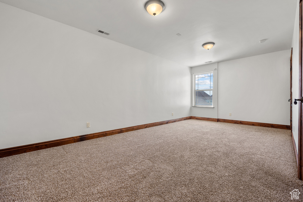 Empty room featuring carpet floors