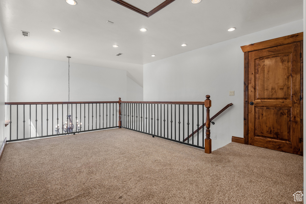 Empty room with carpet and recessed lighting