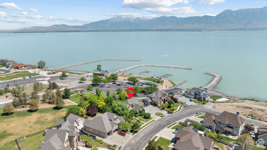 View of property location featuring a water and mountain view