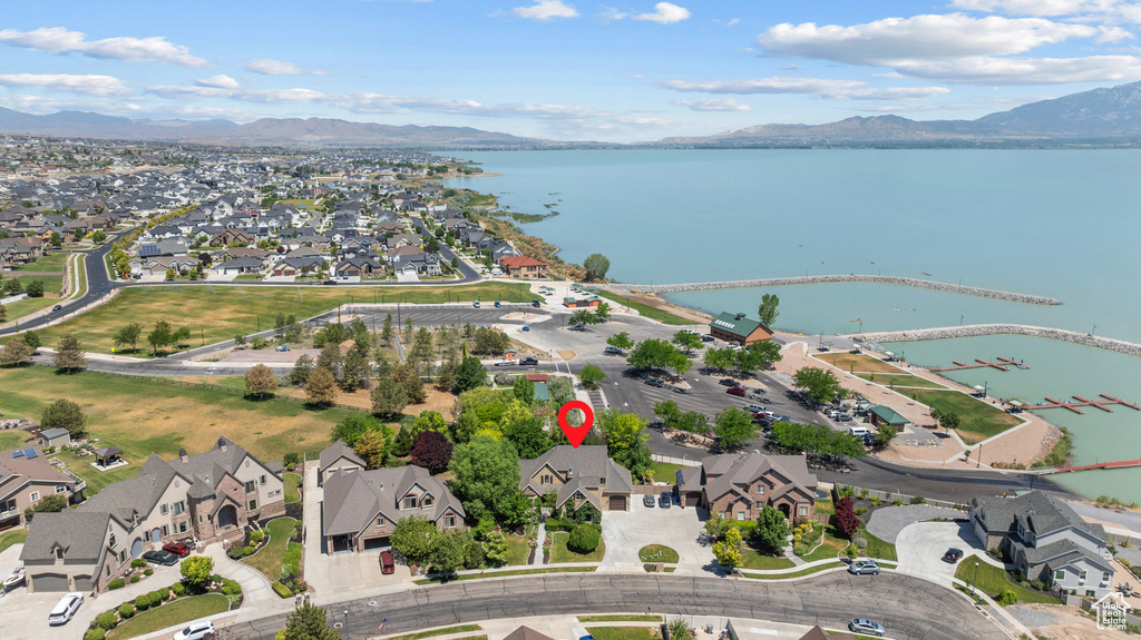 View of property location with a water and mountain view and nearby suburban area