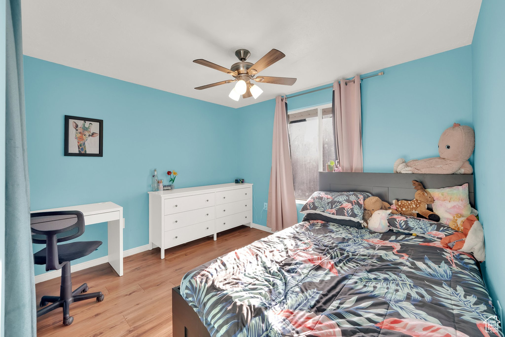 Bedroom with wood finished floors and ceiling fan