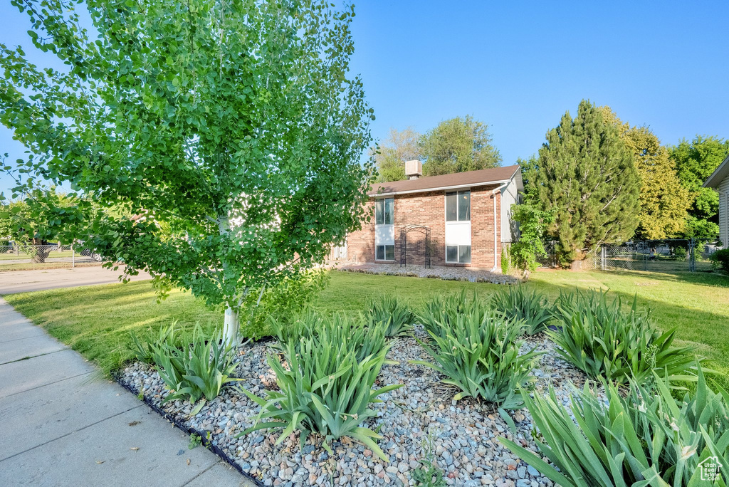 View of front of home featuring brick siding