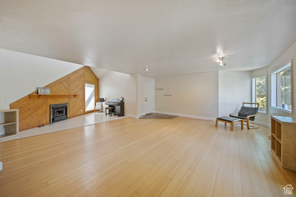 Living area with light wood-style floors and baseboards