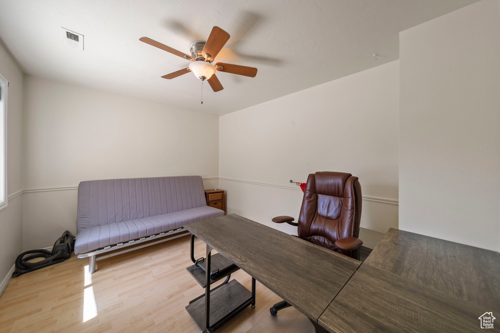 Office space featuring wood finished floors and ceiling fan