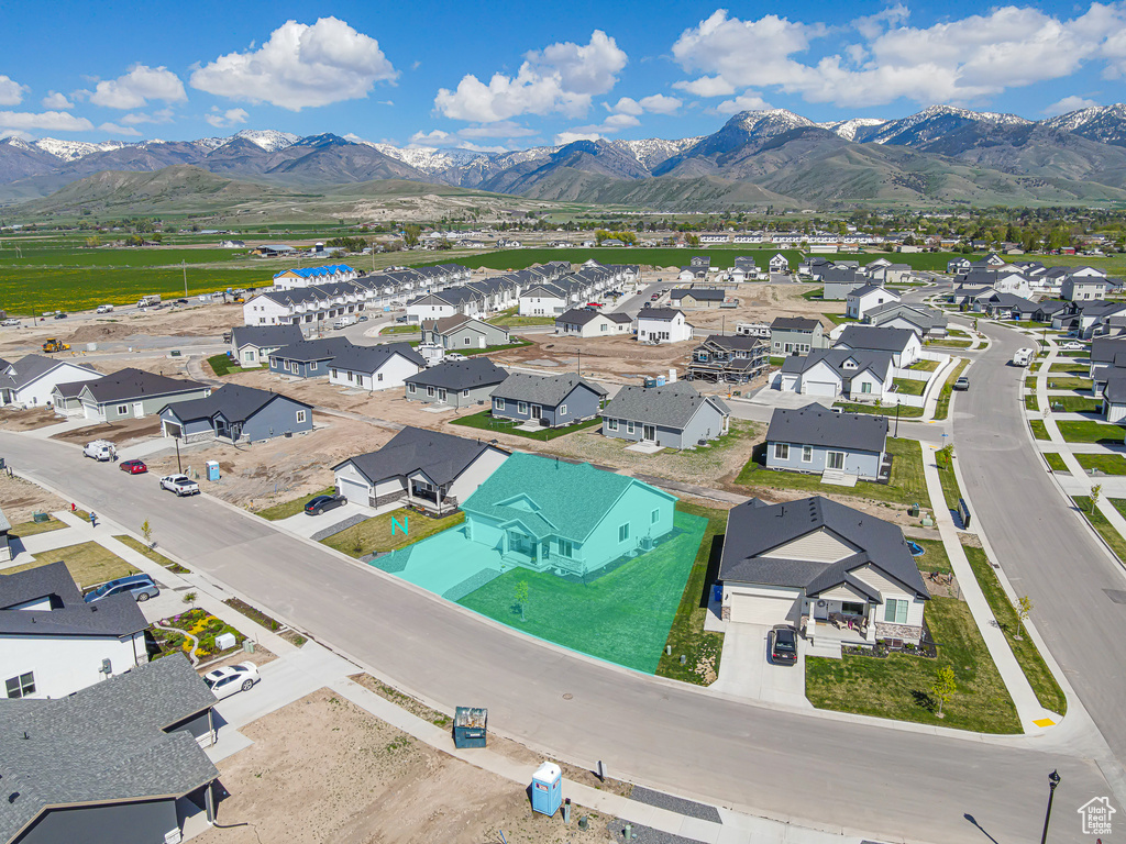 Aerial view of residential area featuring mountains
