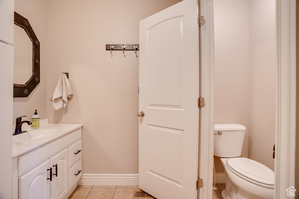Bathroom with vanity and tile patterned floors