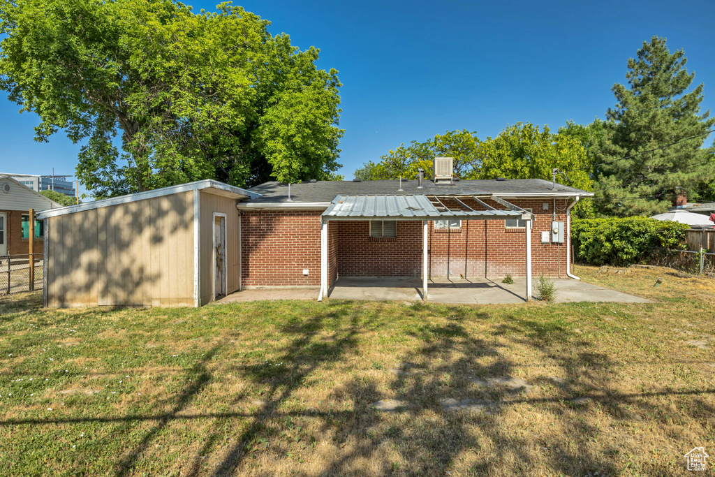 Back of property featuring a patio area and brick siding