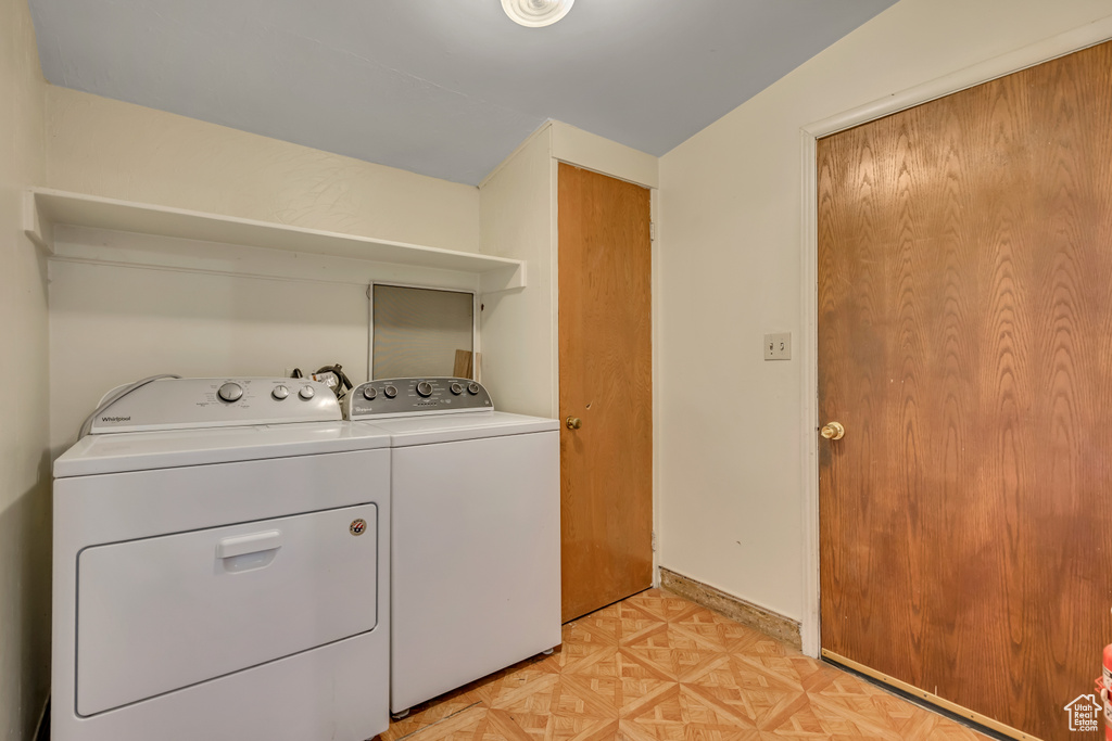 Laundry area with washing machine and clothes dryer