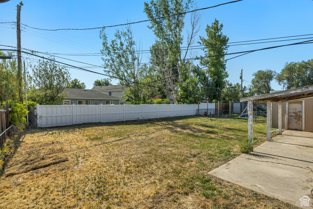 Fenced backyard featuring a patio area