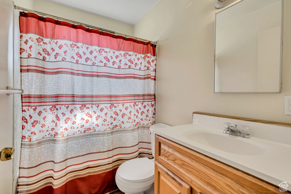 Bathroom featuring vanity and a shower with curtain