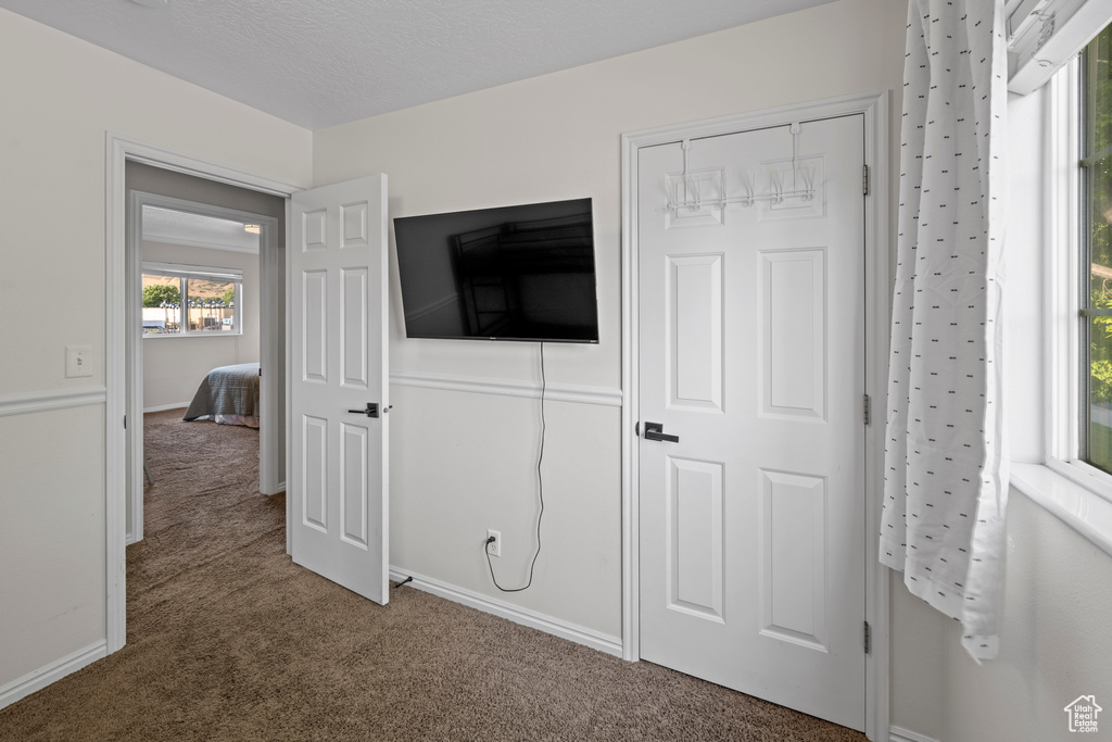 Unfurnished bedroom with carpet flooring and a closet