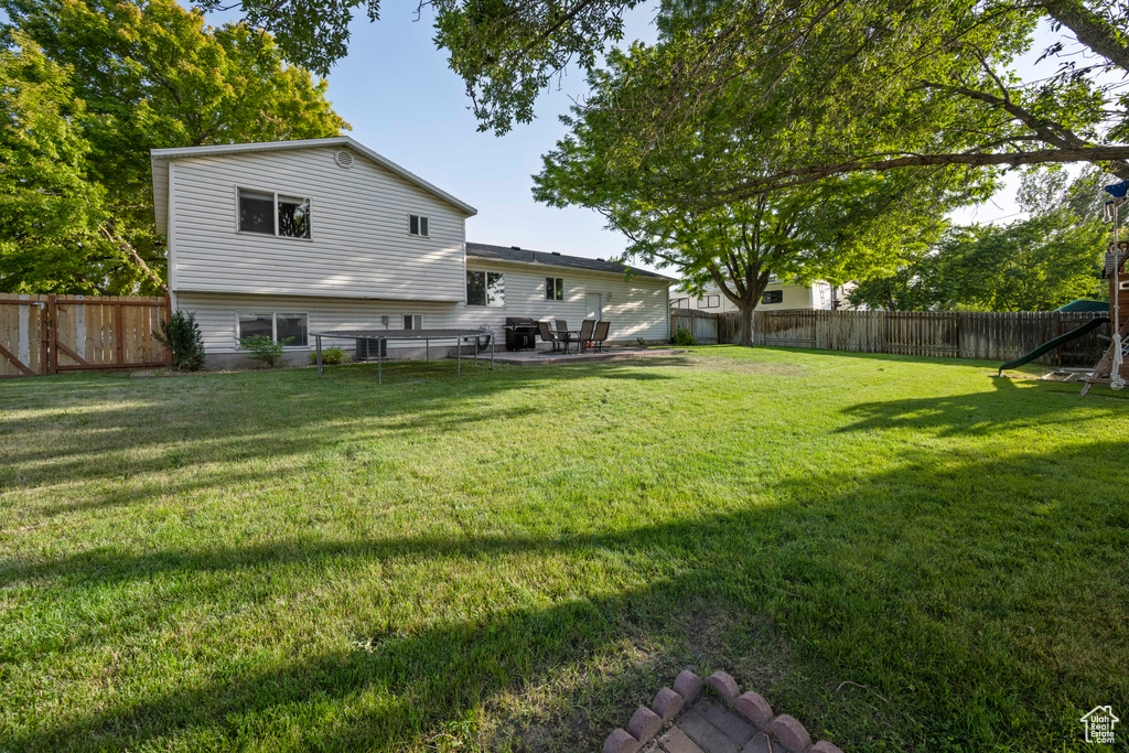 Fenced backyard featuring a patio area