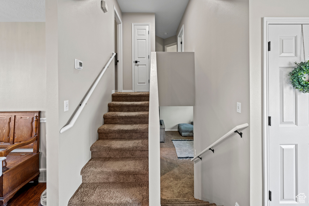 Stairs featuring baseboards