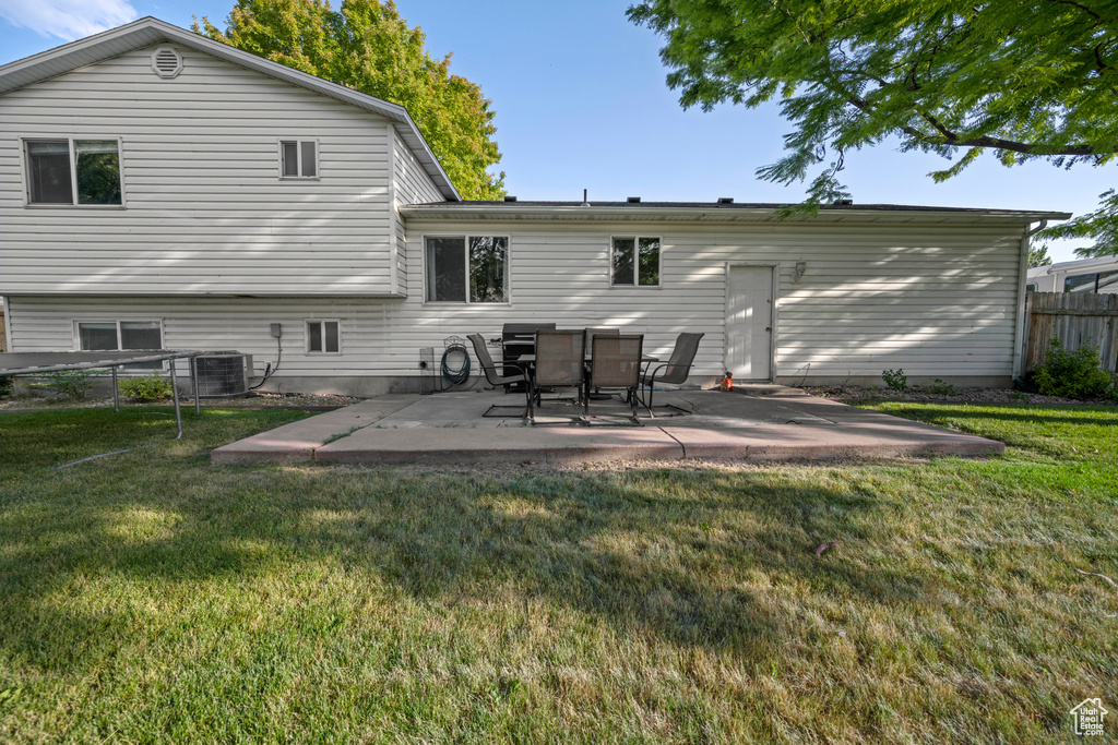 Back of house with a patio