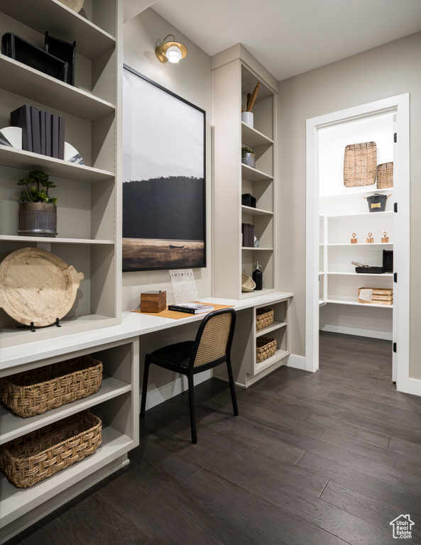Office space with dark wood finished floors and baseboards