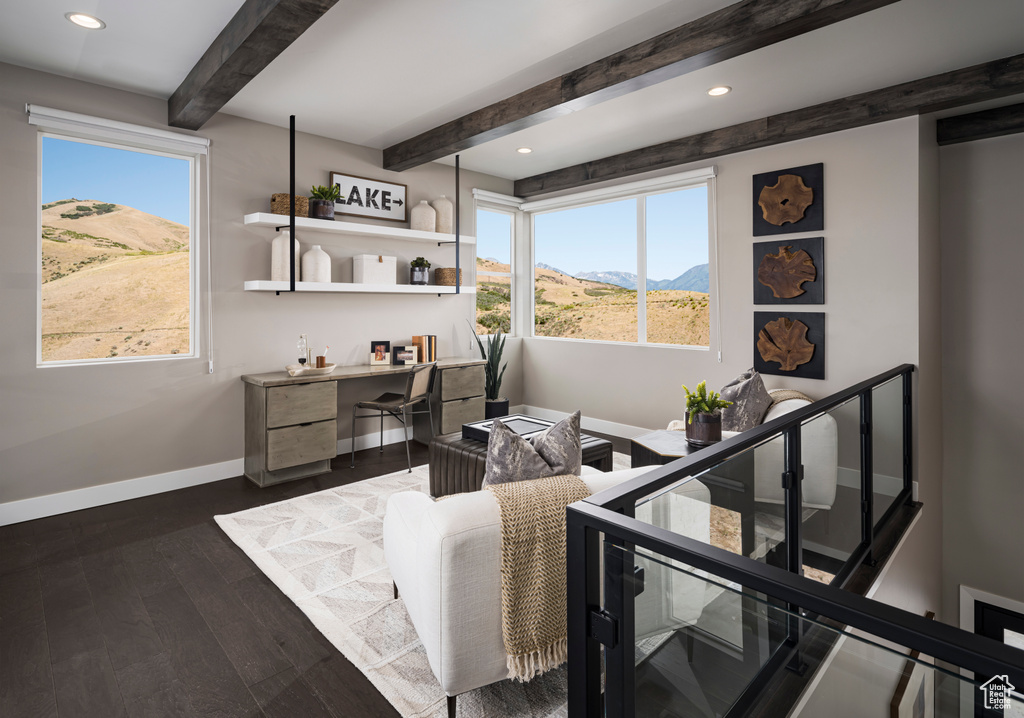 Office area with healthy amount of natural light, dark wood finished floors, beamed ceiling, a mountain view, and recessed lighting