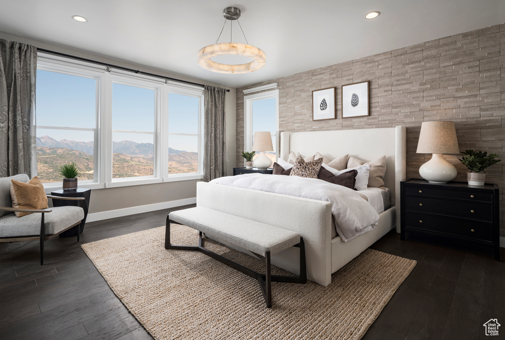 Bedroom with dark wood-type flooring and recessed lighting