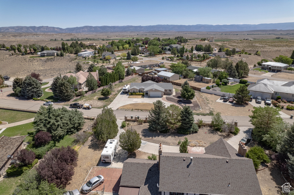 Aerial view of residential area featuring a mountain backdrop
