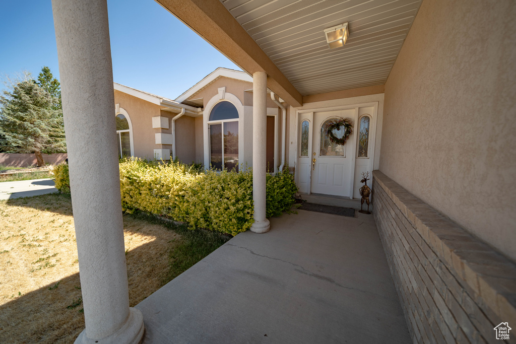 Doorway to property with stucco siding