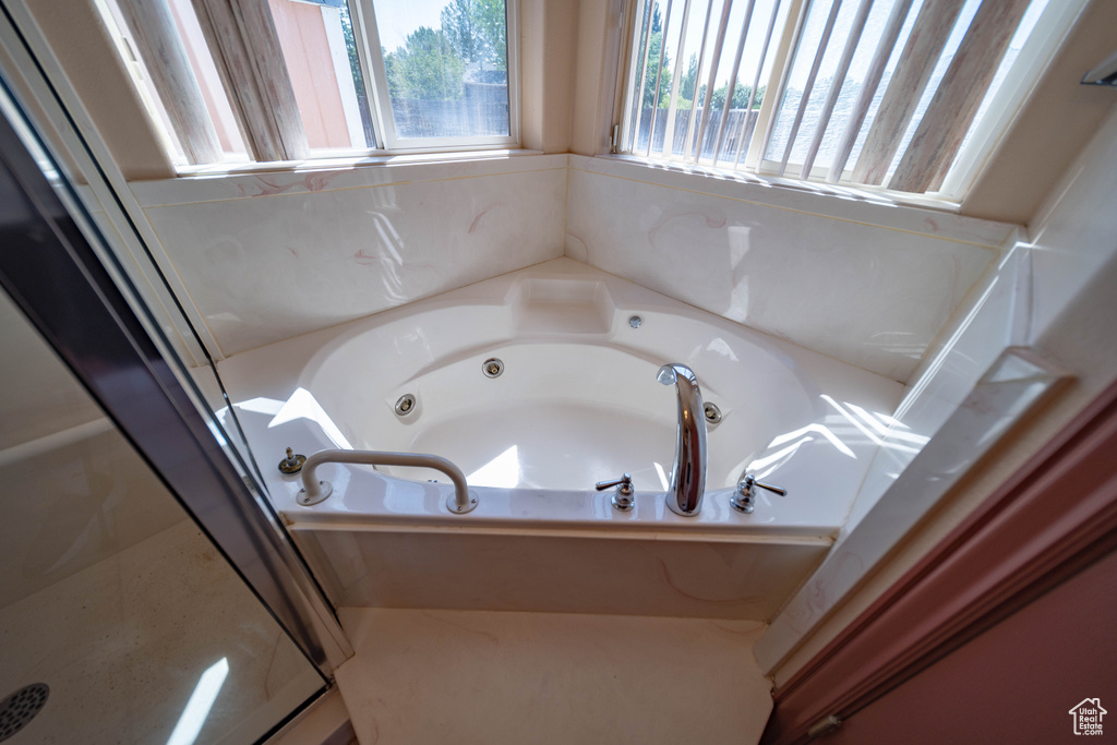 Full bath featuring a jetted tub