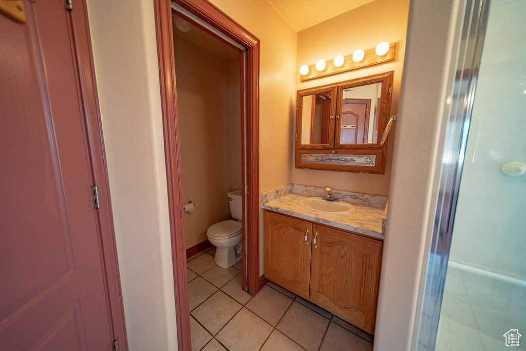 Bathroom featuring vanity and tile patterned flooring