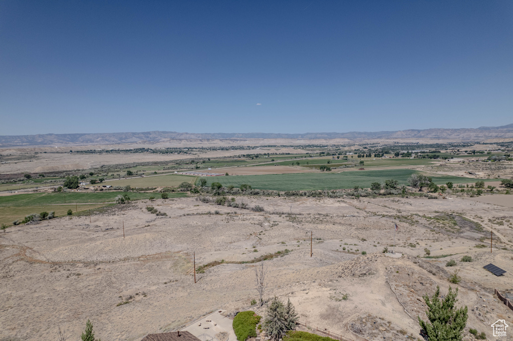 View of mountain background featuring rural landscape