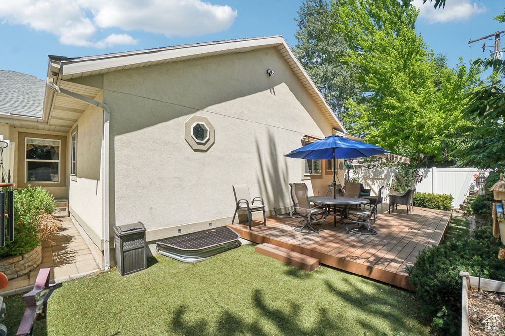 View of patio / terrace with a deck and outdoor dining area