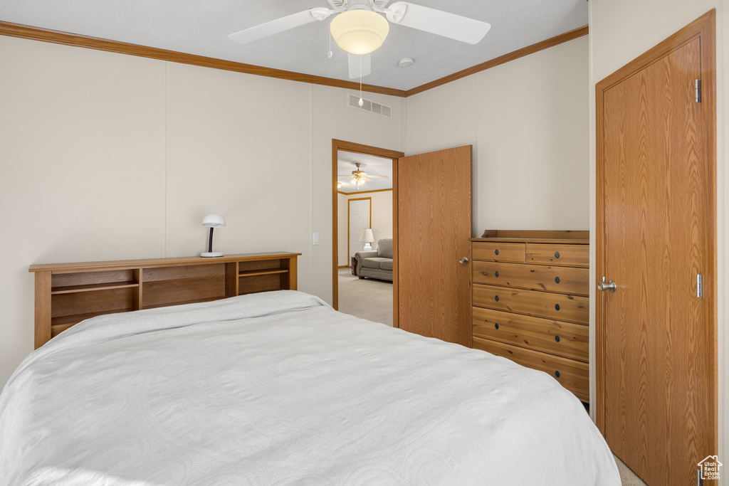 Bedroom featuring crown molding and ceiling fan