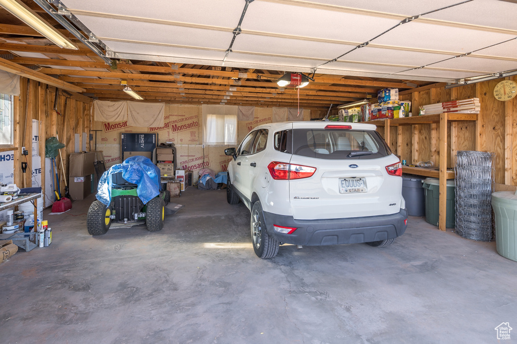 Garage featuring a garage door opener