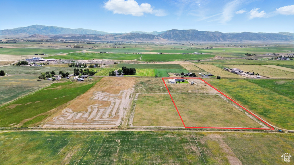 View of rural area featuring property parcel outlined and a mountain backdrop