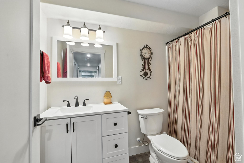 Bathroom featuring vanity and wood finished floors