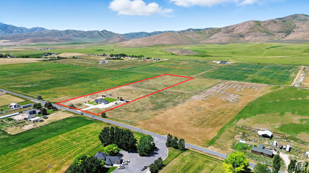 View of rural area featuring property parcel outlined and mountains