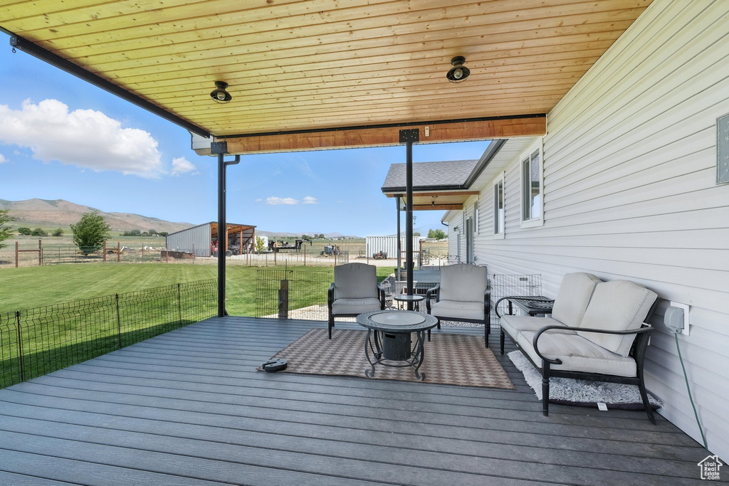 Wooden terrace featuring a mountain view