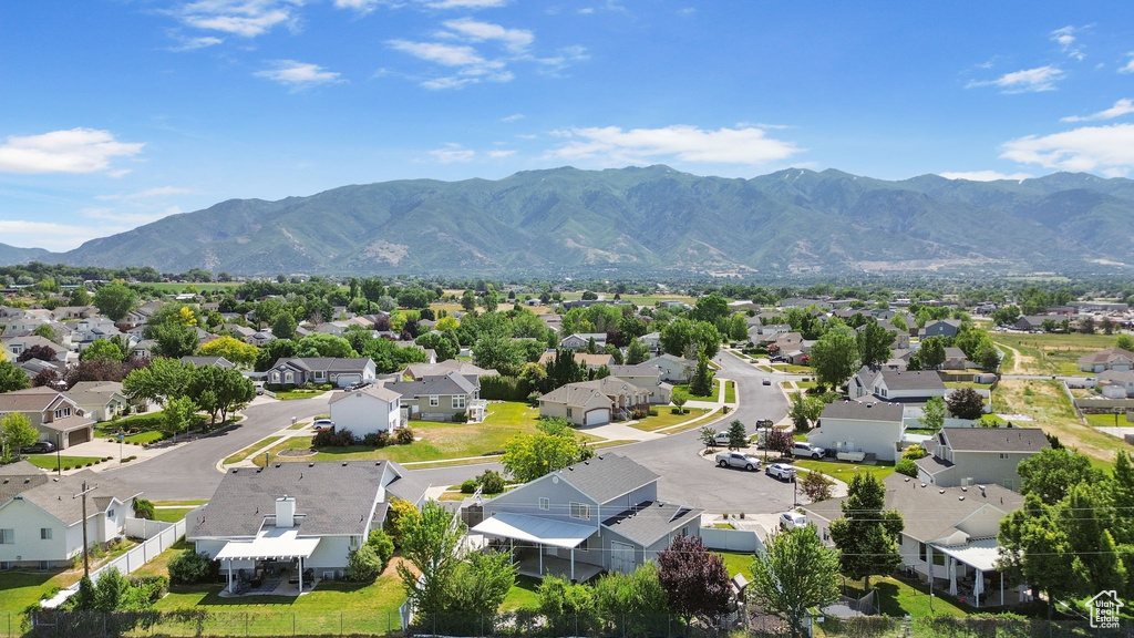 Aerial perspective of suburban area with a mountainous background
