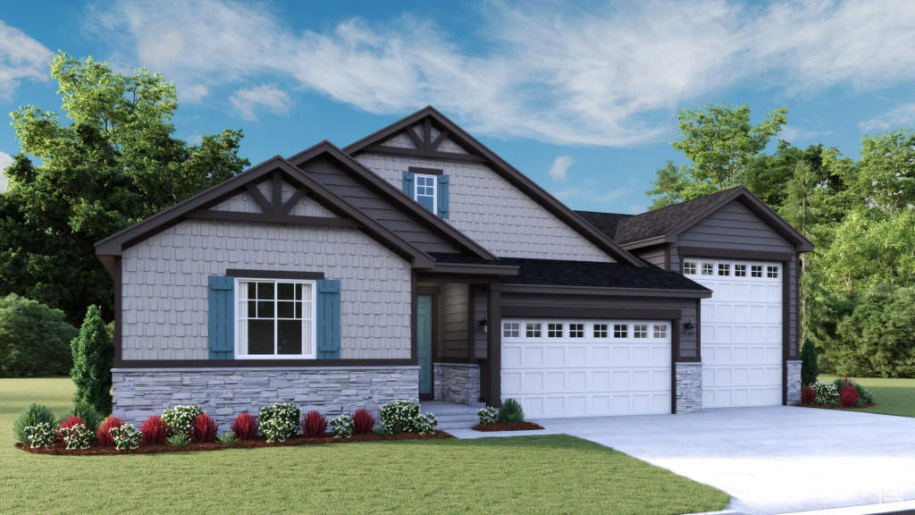 Craftsman house featuring stone siding, a garage, and a front lawn