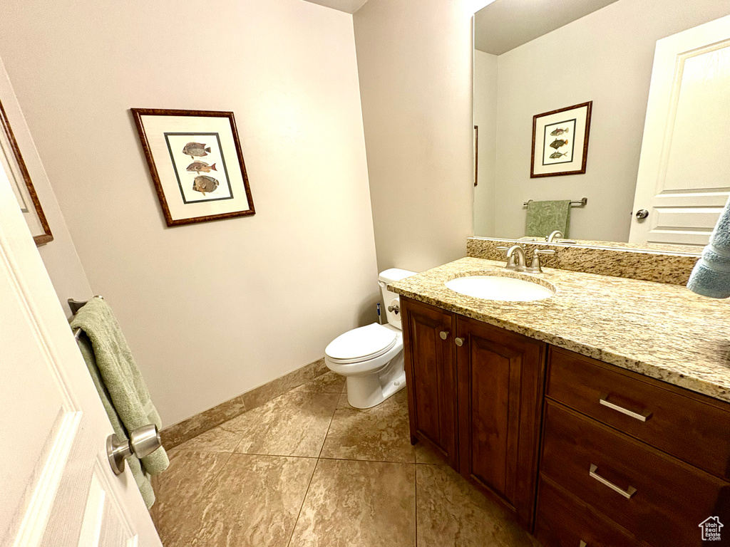 Bathroom with vanity and tile patterned flooring