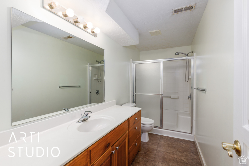 Full bathroom featuring vanity and an enclosed shower