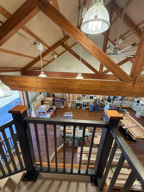 Interior space with high vaulted ceiling, ceiling fan, and beamed ceiling